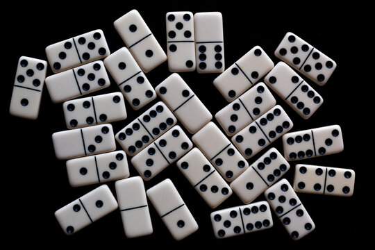 Domino tiles on black background. - Powered by Adobe