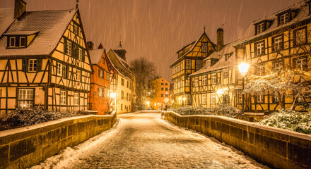 Obraz premium Charming winter evening on a snow-covered historic european street