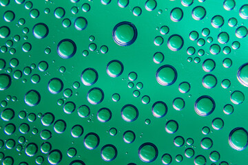 Water bubbles with a green background to be used as a background or texture.