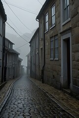 Obraz premium Misty Coastal Village Street – Cobblestone Path in an Isolated, Foggy Landscape