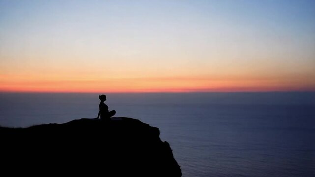Meditative Yoga Pose on a Cliffside at Dusk