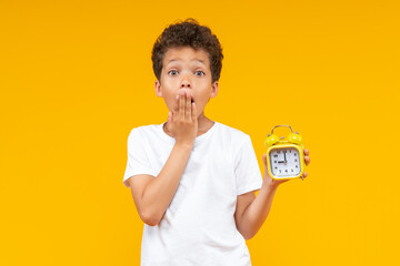 Schoolboy regreting to skip the school because he forgot to set the alarm clock