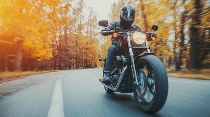 Motorcycle driver riding alone on asphalt motorway. Outdoor photography. Travel and sport, speed...