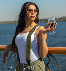 Tourist celebrating her independence on a Nile cruise. Exploring ancient temples, allowing herself...