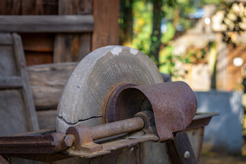 old hand grinder on a farm, wild west © Adam