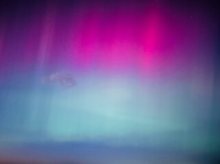 Stunning, dreamy display of vivid colors seen from aurora borealis, northern lights over Long...