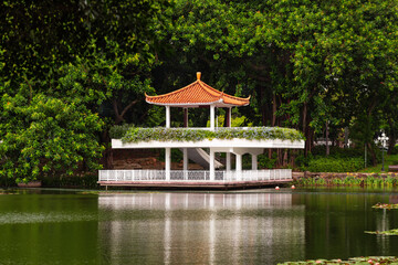 Pagoda gazebo on the shore of a pond