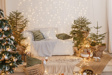 Interior bedrooms in Scandinavian style, decorated for the Christmas holidays. Live ate in the interior.