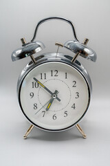 A Classic Chrome Bell Alarm Clock Isolated on White Time 6.52