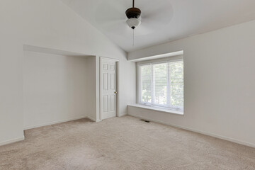 Empty Bedroom With Soft Carpet And Large Window