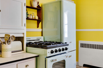 Bright Yellow Kitchen With Pastel Retro Appliances.