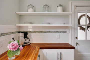 Elegant Kitchen With Wooden Countertops And Decor.