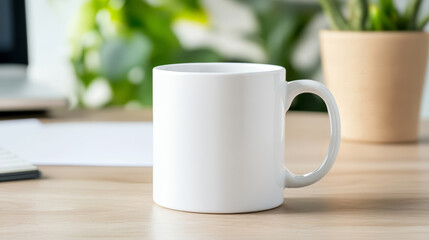 Bright office space with white mug, laptop, and plant on desk, ideal for mockups
