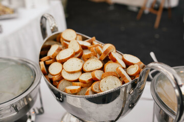 Tray Filled With Sliced Baguettes Ready For Serving.