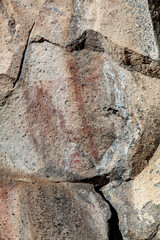 Obraz premium red wall with Petroglyph