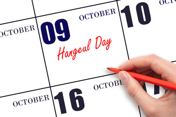 October 9. Hand writing text Hangeul Day on calendar date. Save the date.