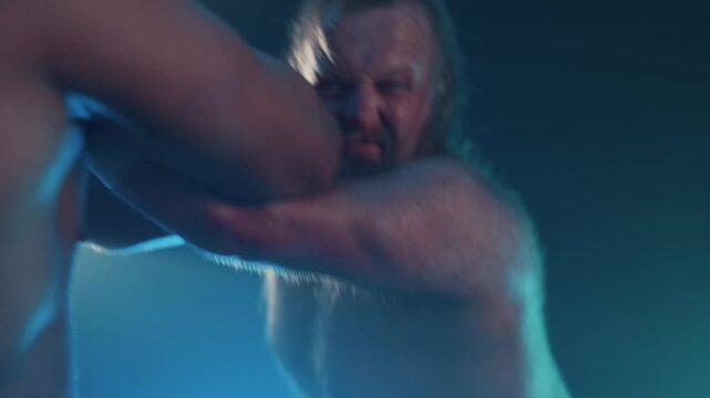 Wrestlers grappling during wrestling match