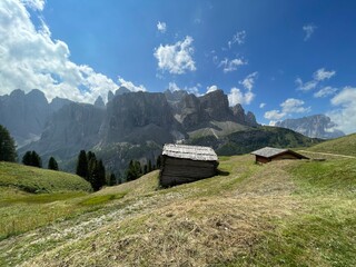 Mountain hut over Colfosco, Calfusch and panoramic view of Gruppo del Sella, Sellagruppe in Alta Badia Valley, Dolomites , Trentino, Alto Adige, Sudtirol, South Tyrol, Italy