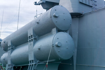 naval military background, concept, fragment of a modern warship with missile launcher containers