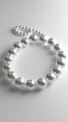 Obraz premium Elegant pearl necklace, white background, 4K hyperrealistic photo