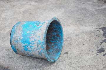 Old and dirty plastic buckets by the roadside