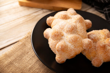 Pan de Muerto. Typical Mexican sweet bread that is consumed in the season of the day of the dead. It is a main element in the altars and offerings in the festivity of the day of the dead.