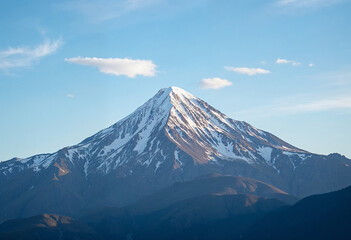 Fototapeta premium Majestic Snow-Capped Mountain Under Clear Blue Sky