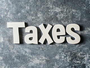 Fototapeta premium Cutting through the paper clutter of taxes: a creative approach to managing financial documents