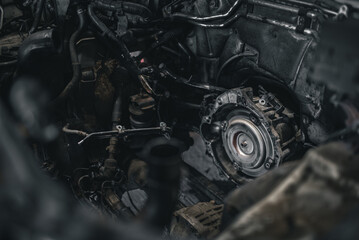 Torque converter sticking out of automatic transmission with engine removed on a modern car.