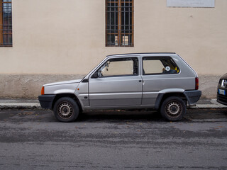 Old silver fiat panda smart van parked on the side of the road