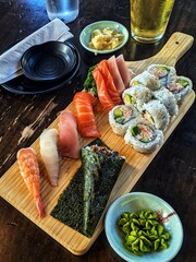 Sushi sashimi platter featuring an assortment of fresh, vibrant slices of salmon, tuna, and other seafood delicacies