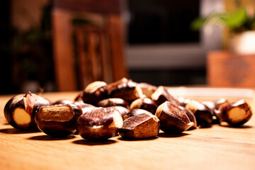 chestnuts on table in front of blurred background