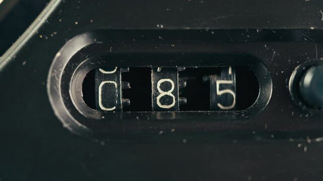 Black mechanical counter on magnetic tape music player. The black mechanical meter has from zero. 