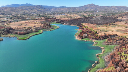 Obraz premium Aerial drone photo of lake and dam of Marathon after mega fires of Athens in August 2024, Attica, Greece