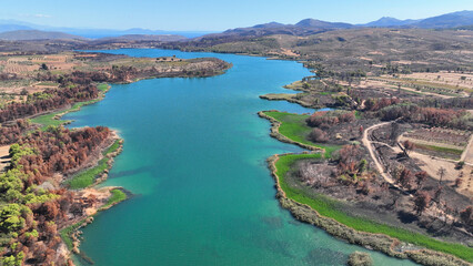 Aerial drone photo of lake and dam of Marathon after mega fires of Athens in August 2024, Attica, Greece