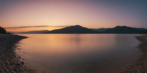 Fototapeta premium The sun sets over the ocean, its rays reflecting in calm water