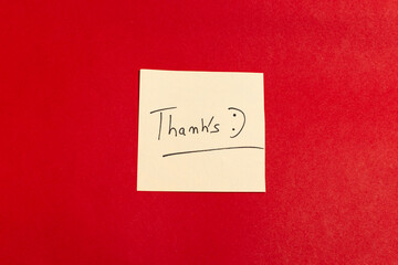 A thank you note is written on a red background
