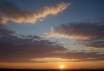 Fototapeta premium The sun sets over the ocean, its rays reflecting in calm water