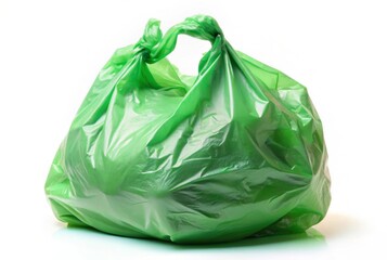 A green plastic bag is on a white background
