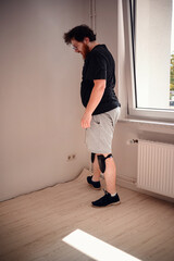 Man Inspecting Newly Installed Laminate Flooring