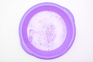 Bubbles of washing detergent foam in basin, hand wash concept