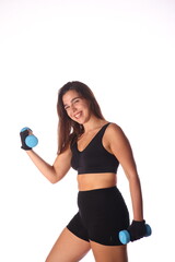 Fototapeta premium young smiling woman with 2 blue dumbbells in front of white background