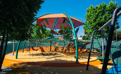 Children's complex of different swings and nets . Bright and safe game that can be played by children.