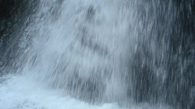 A waterfall flowing over mossy stones into its pond, slow motion, Josefsthaler Wasserf&auml;lle