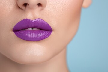 Close-up of glossy purple lips on a light blue background, minimalistic composition with copy space. Bold lipstick makeup concept for beauty, cosmetics, and advertising designs.

