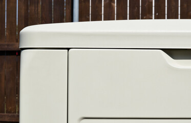 Standby home generator partial in residential backyard emergency backup power supply.	