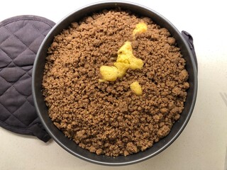 crumb cake in a round tin from above