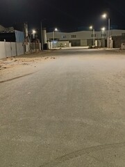 view from home at night,road and buildings 