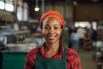 Portrait of a smiling African American female worker at factory