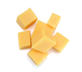 Cubes of cheddar cheese isolated on white